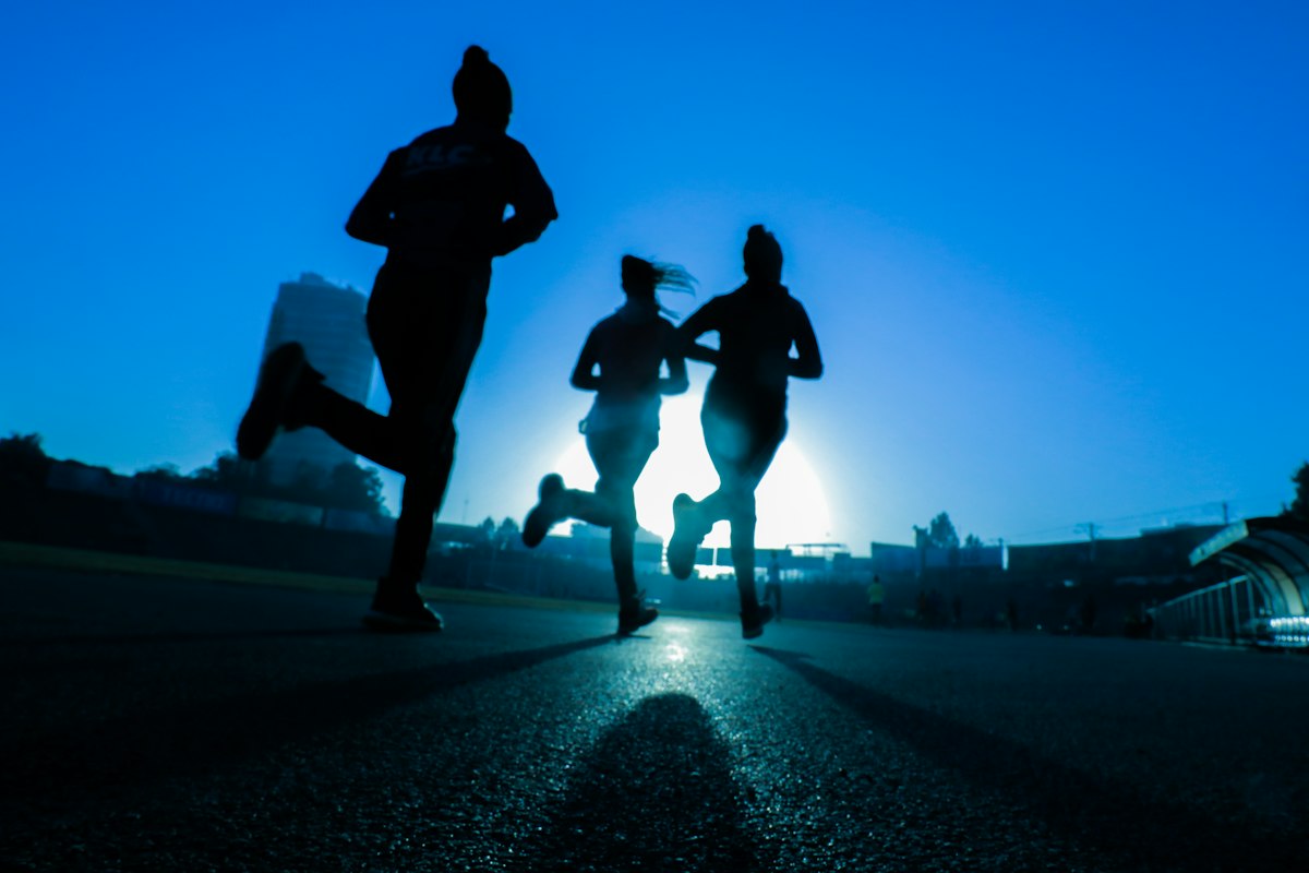People running together at sunrise, living in good health